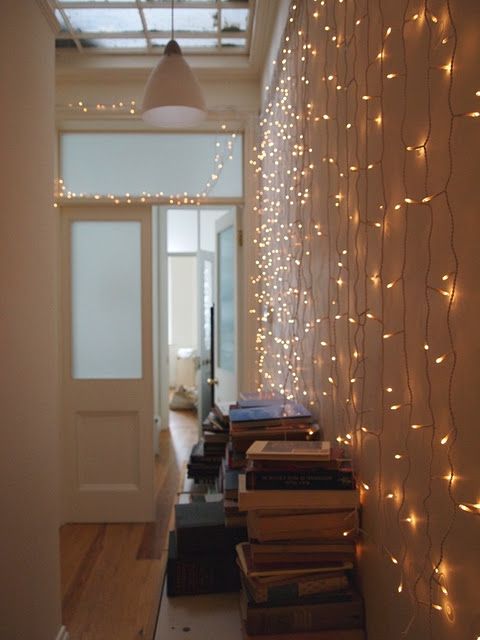 string lights on the wall will make the entryway more welcoming