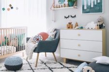 15 a gender neutral nursery filled with toys and with bright touches of colors