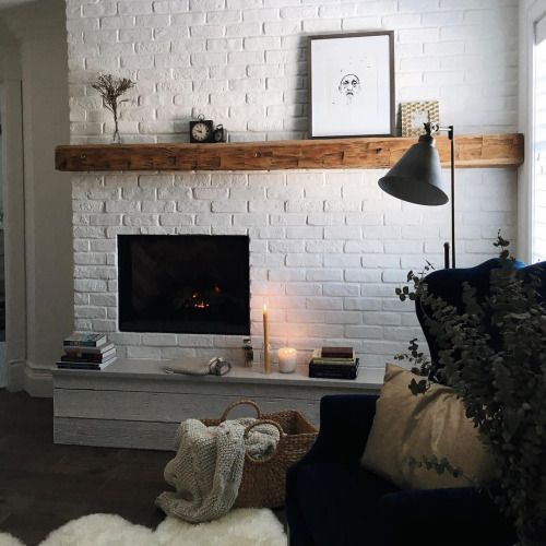 accent the fireplace with an exposed white brick wall, a faux or real one