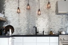 16 glossy silver tiles covering the whole wall are just jaw-dropping