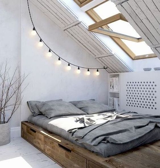 some string lights add light to this attic space