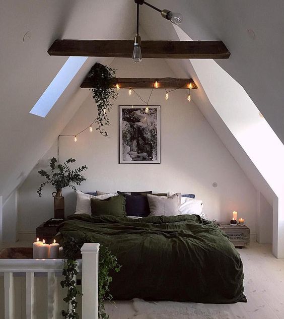string lights and candles to add more light to this attic bedroom