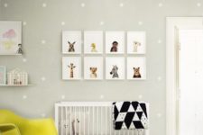 18 a cheerful dove grey and yellow nursery with animal pics, a polka dot wall and a fun chandelier
