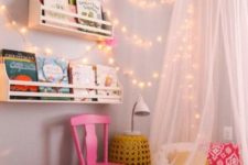 18 a colorful reading nook with a teepee and string lights on the wall