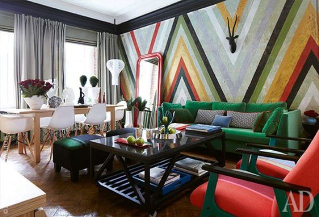 accent made with a colorful stripe geometric wall and bold furniture