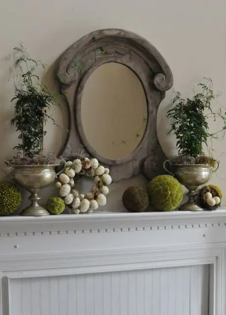 an egg wreath, moss balls and potted greenery plus a vintage mirror for a vintage space