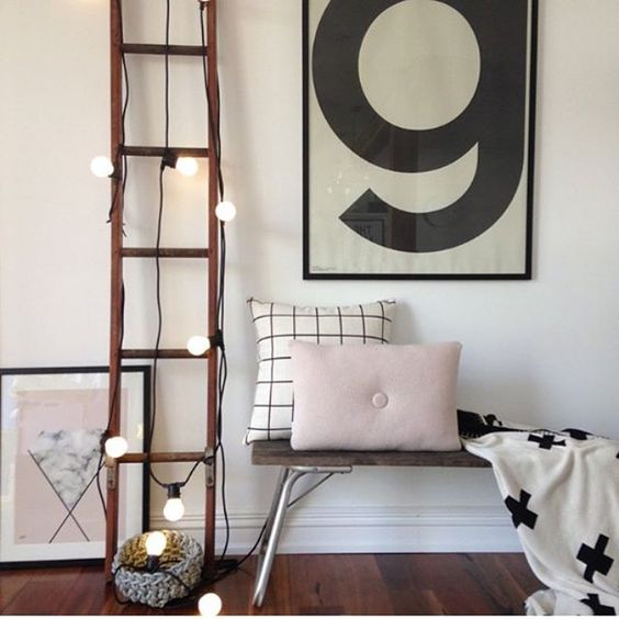 cover the ladder with string lights to make the space cute and use it for storage