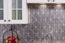 19 Moroccan-inspired silver tiles make the neutral kitchen much more special