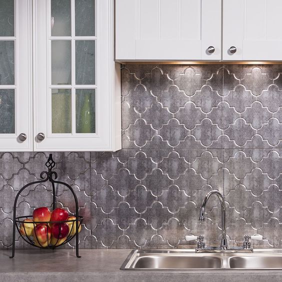 Moroccan-inspired silver tiles make the neutral kitchen much more special
