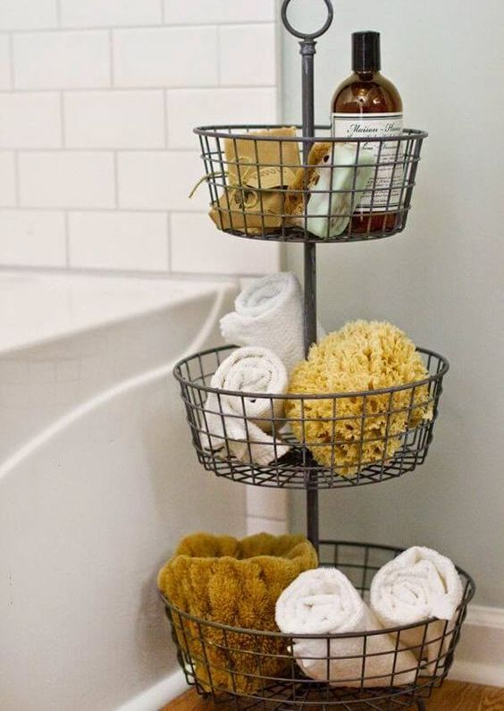 a tiered metal basket organizer for a bathroom
