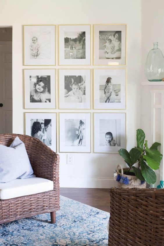 an elegant gallery wall in gold frames with personal family photos is ideal for any room