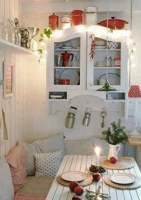 string lights over the cabinet are great for holiday and all-year-round decor