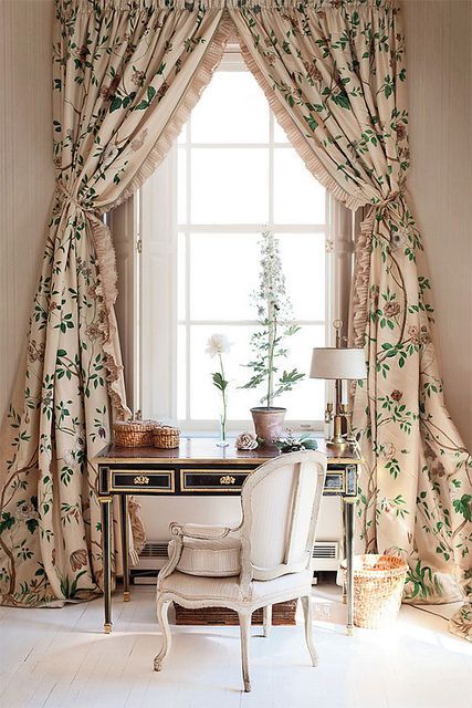 botanical print curtains with ruffles make this refined home office more interesting