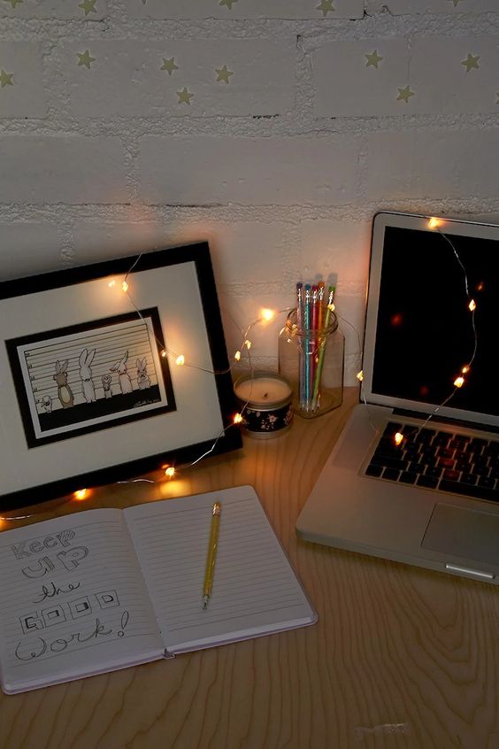 some string lights put right on teh desk to make it shine and inspire you