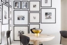 23 a breakfast nook made more special with a corner gallery wall with black frames and family pics