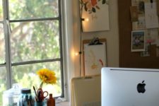 23 bring more light to your working space with string lights hanging next to it