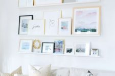 24 a seaside-inspired gallery wall placed on ledges to change the place and artworks easily