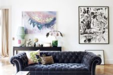 24 an airy living room in neutral shades with a bold velvet Chesterfield and artworks