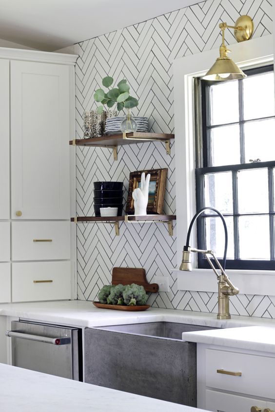 long white tiles clad in a chevron pattern and accented with black grout
