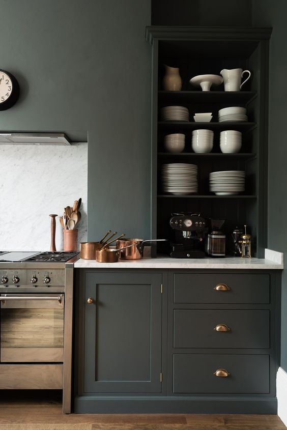 graphite grey walls and absolutely matching cabinets with white marble countertops