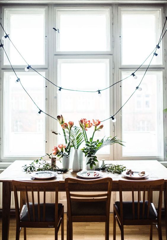 hang string lights over the dining space to separate it from the kitchen itself
