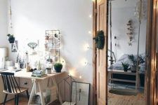 25 string lights over the doors and on the wall add coziness to the space