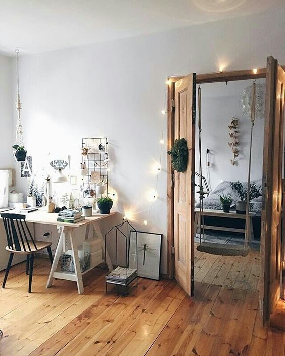 string lights over the doors and on the wall add coziness to the space
