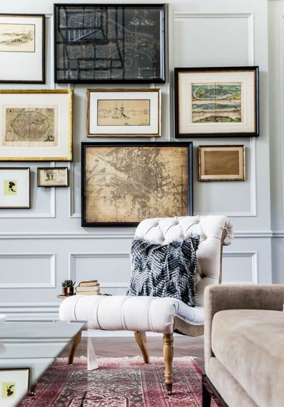 a vintage-inspired and travel-inspired gallery wall with various frames and looks