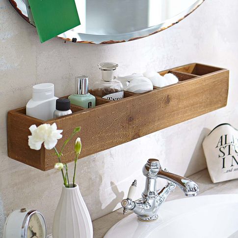 a small bathroom shelf over the sink as an organizer