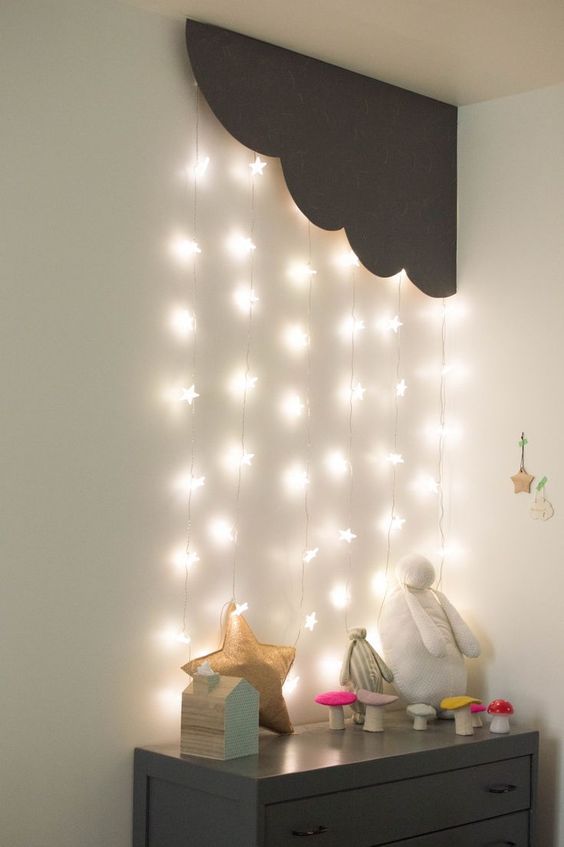 Star shaped string lights fro a cloud in the corner of the room where the storage is