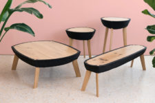 01 Fikra tables collection features various models of tables made of wood and rubber