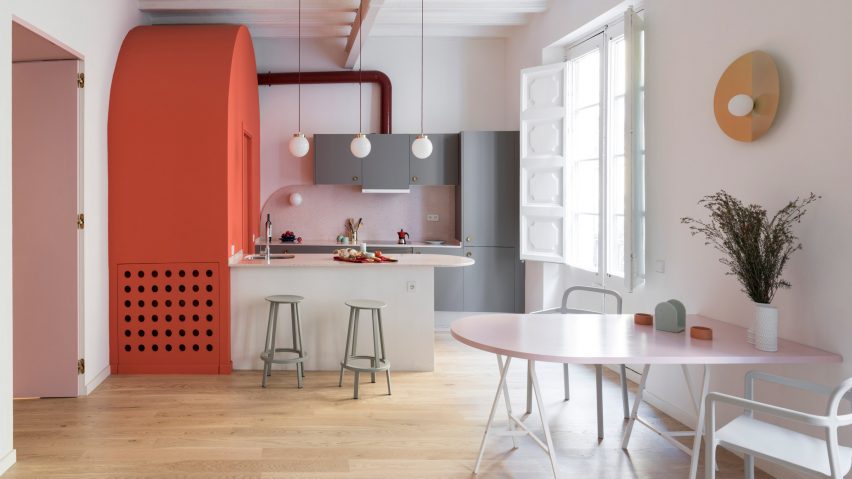 This colorful apartment is located in Barcelona and features interesting solutions and color blocking with a retro feel
