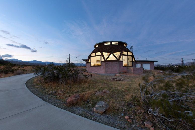 This isn't your typical mid century modern home, it features a unique dome shape and creatively shaped windows that make it special