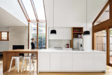 stylish white kitchen design with wooden elements