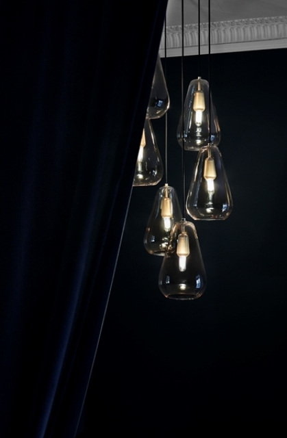 The pendants are made of metal and hand-blown glass, which is a classic combo that can fit any modern space