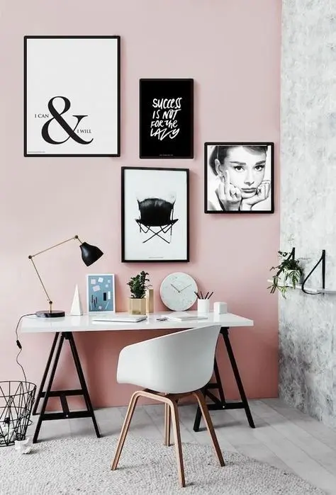a black and white gallery wall makes this girlish space calmer and more elegant