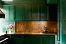 02 a brushed brass backsplash with art deco emerald cabinets look fantastic and very bold