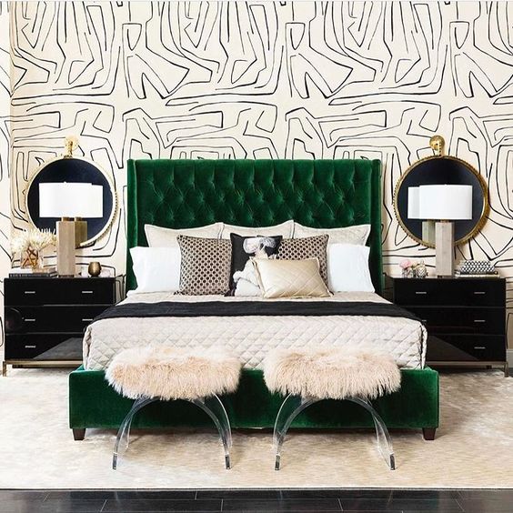 a quirky printed black and white wallpaper wall highlights the bold art deco style of the room