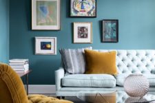 02 an asymmetrical colorful gallery wall makes a trendy statement in the living room