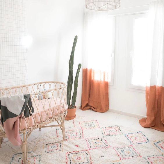 ombre orange curtains are a nice idea to add a colorful touch to a nursery