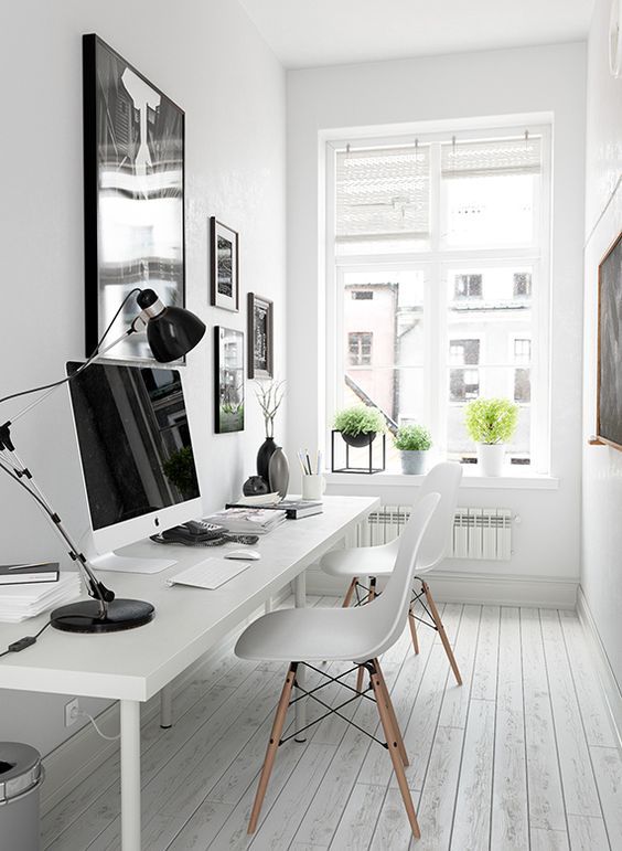 A black and white gallery wall over the desk gives more style to the space