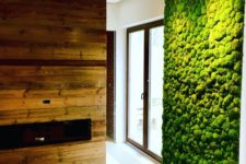 03 a fresh moss wall and a reclaimed fireplace wall bring a strong natural and relaxing fele to the space