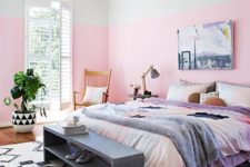 04 a colorful bedroom with watercolor bedding, a wicker pendant lamp and a vintage storage bench