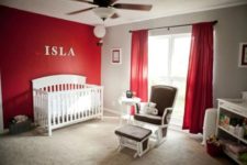 04 red curtains and a red statement wall is a great choice for a nursery