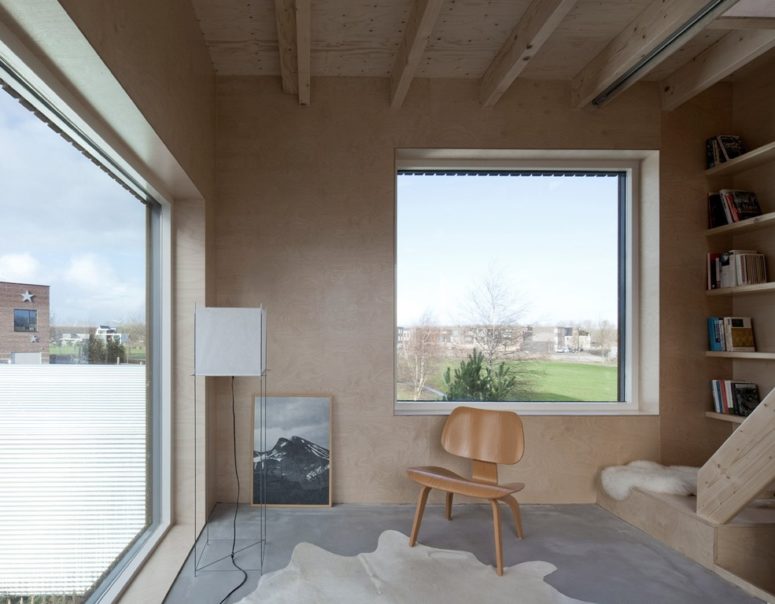 Large windows provide natural light and ventilation and create a feeling of spaciousness