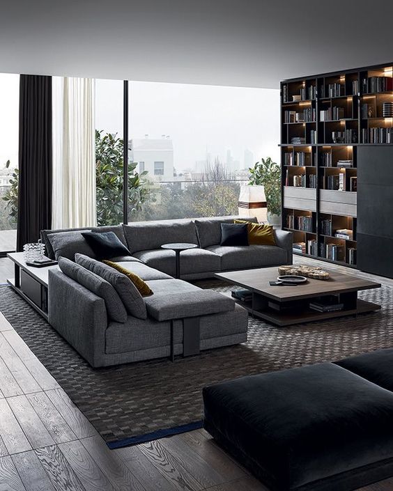 A dove grey L shaped sofa matches the contemporary and edgy room style and makes it look bold