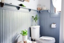 05 a modern farmhouse bathroom with tall powder blue wainscoting for adding color to the space