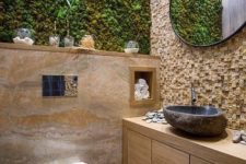 05 an eco-friendly bathroom with a moss wall and some wood and stone in decor