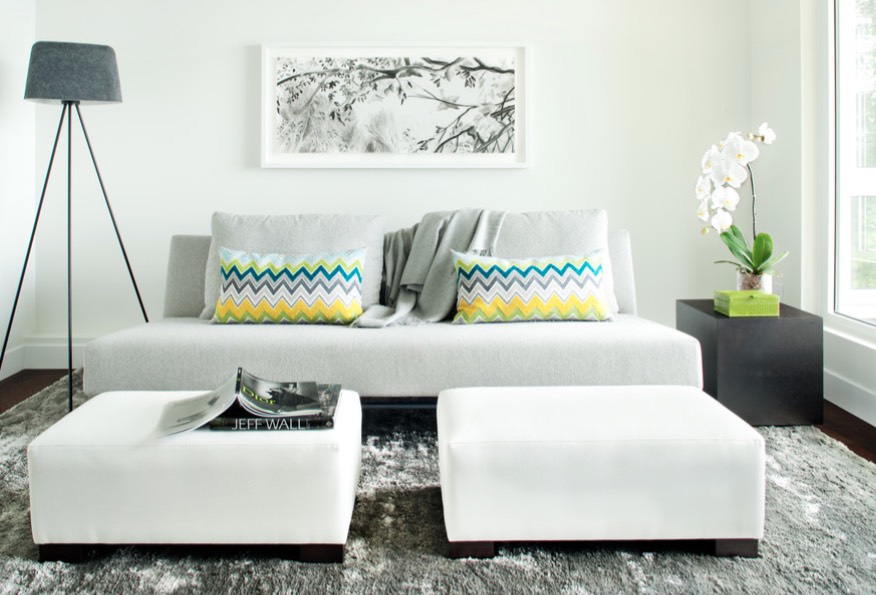 Large ottomans in a luxurious creamy shade make the space bold and chic