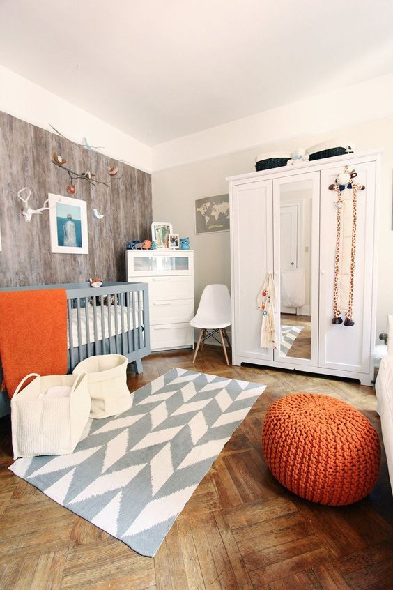some orange accents finish the look and add a cheerful feel to the space